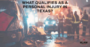 Emergency responders at a nighttime car accident scene in Texas, illustrating personal injury law context.