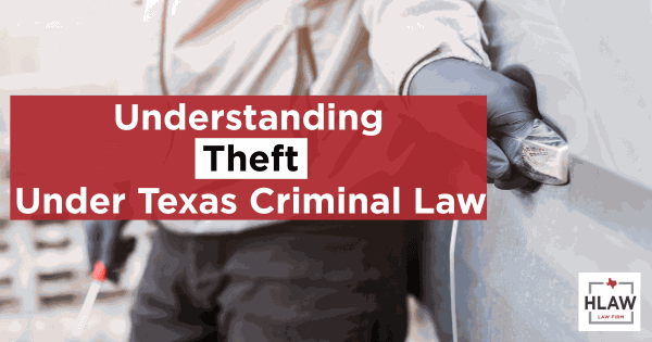 Person attempting vehicle theft with gloved hands and a tool, representing theft crimes in Texas