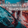 Shattered car windshield on a city street at night with ambulance and pedestrians in the background, illustrating fault in a Texas personal injury case.