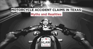 Point-of-view of a rider on a Texas road at night with text overlay “Motorcycle Accident Claims in Texas: Myths and Realities,” promoting HLAW’s motorcycle accident guide.