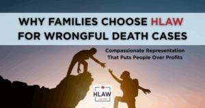Silhouette of one person helping another climb a cliff at sunrise, symbolizing HLAW’s compassionate support for families in wrongful death cases.