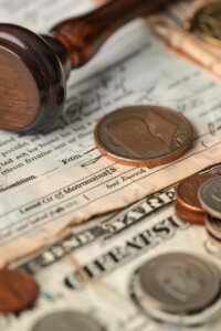 Image representing financial compensation, with coins and legal documents